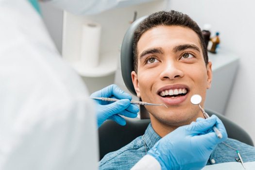 a patient visiting his dentist for a checkup
