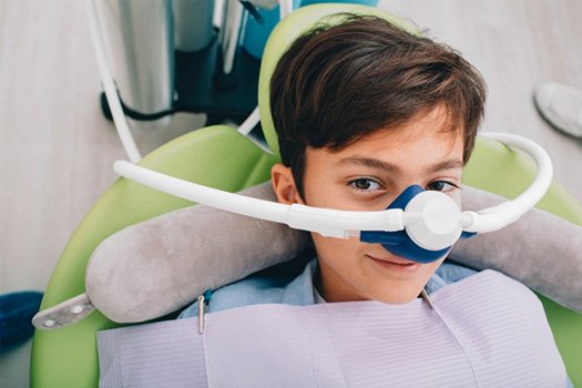 a child patient wearing a nasal mask